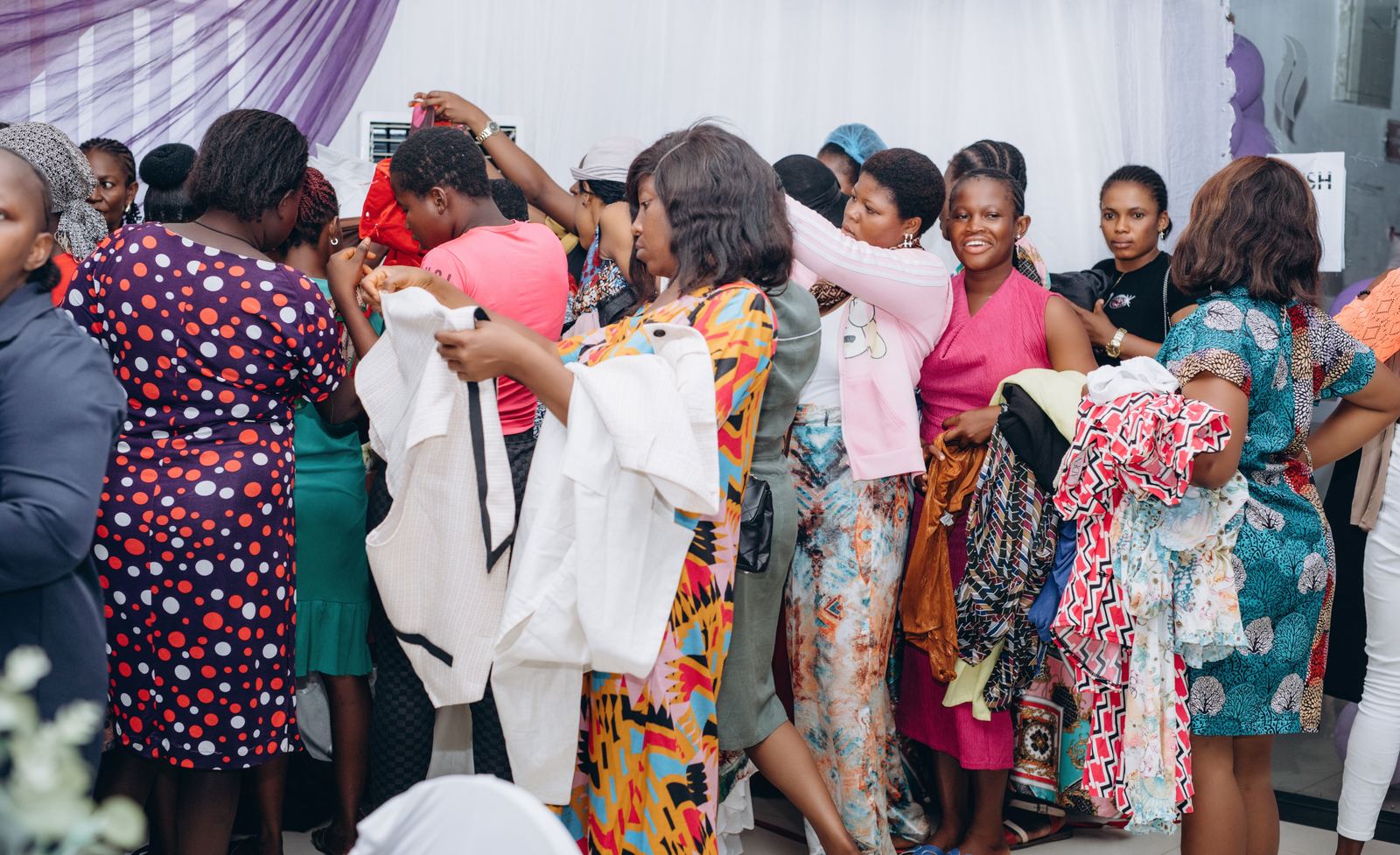 Participants receiving clothing and personal items at a We Remember You event